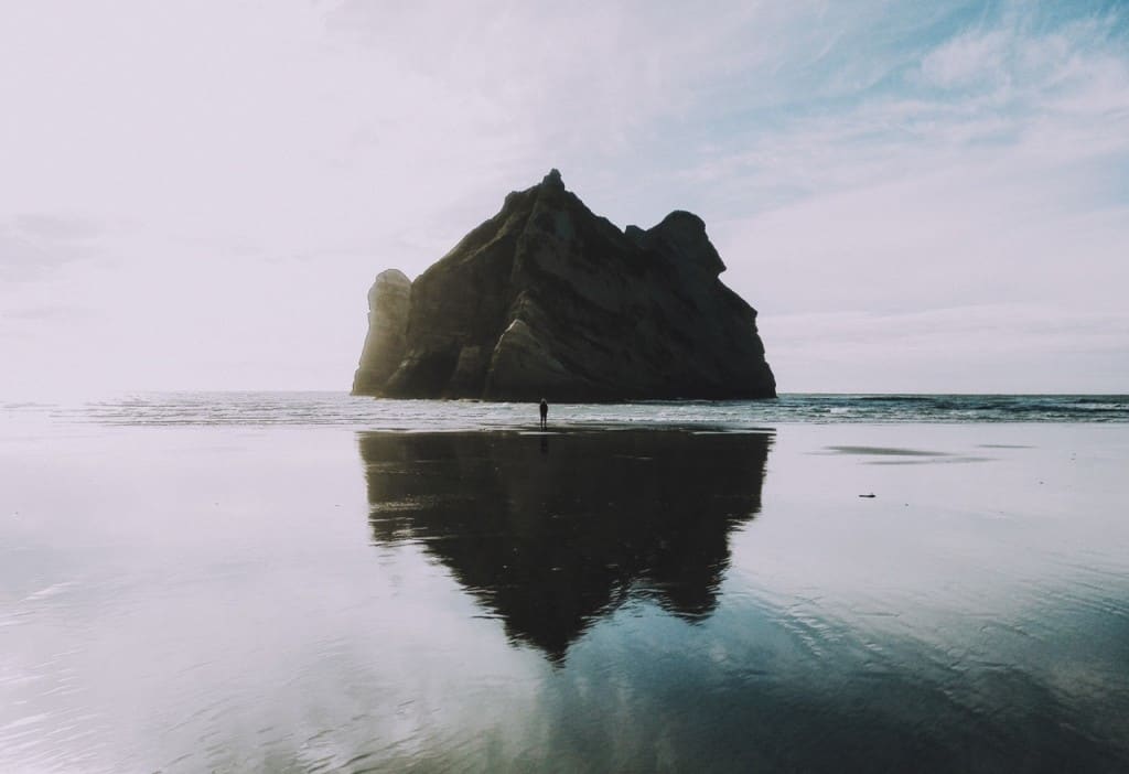 picture of a man near an iland close to shore