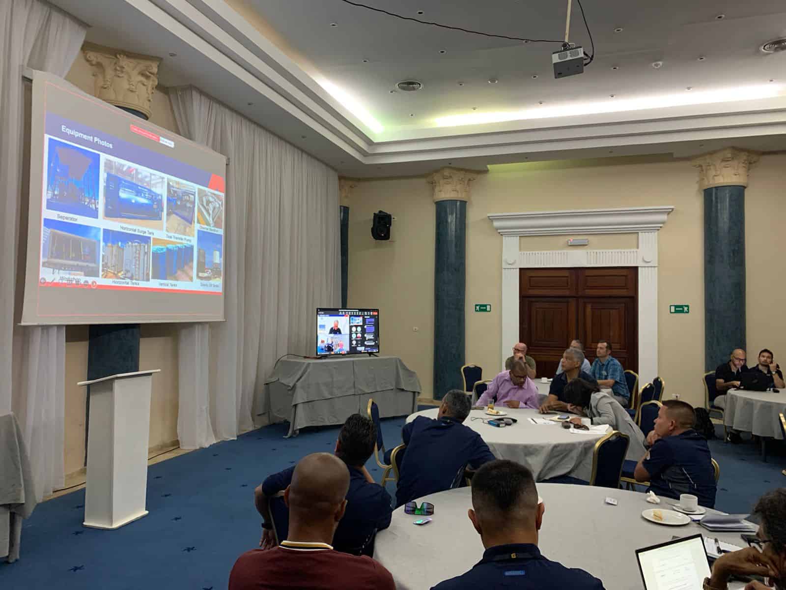 Delegates at front looking at main screen